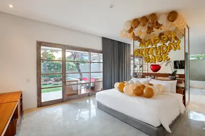 a bedroom with a bed with a happy birthday sign on it at Uma Sapna Seminyak in Seminyak