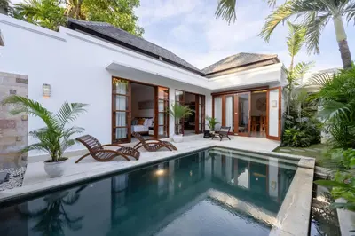 an external view of a villa with a swimming pool at Villa Manis La Bora in Seminyak in Seminyak