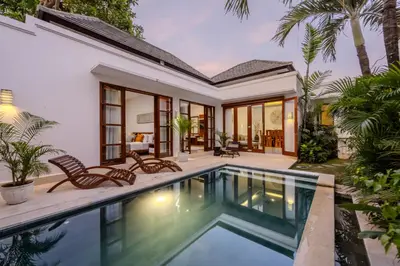 an exterior view of a villa with a swimming pool at Villa Manis La Bora in Seminyak in Seminyak