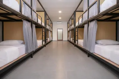 a row of bunk beds in a dorm room at Villa Bunga Hotel in Seminyak