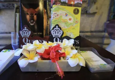 a box with flowers on top of a table at Taman Sari Cottages in Kuta