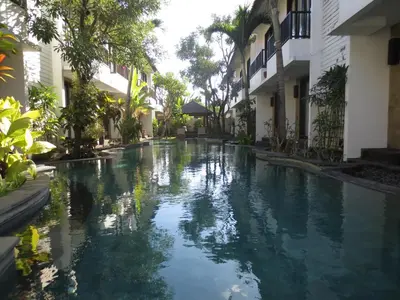 a swimming pool in the middle of a building at Seminyak TownHouse in Legian