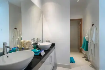 a bathroom with two sinks and a large mirror at Super Value 3 Bed, Central Seminyak, Walk to Beach in Seminyak