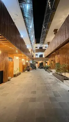 an empty hallway with plants in a building at City Garden Bali Dwipa Hotel, Kuta in Kuta
