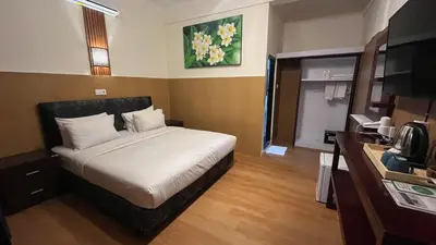 a hotel room with a bed in a room at City Garden Bali Dwipa Hotel, Kuta in Kuta