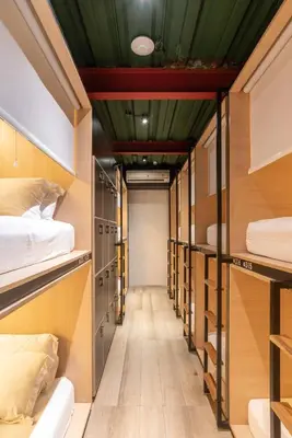 a row of bunk beds in a dorm room at M Boutique Hostel Legian in Legian