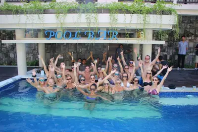 a group of people in a swimming pool at Grand Barong Resort in Kuta