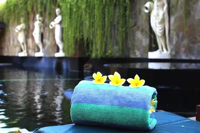 a cake with yellow flowers on top of it at Dewani Villa Resort in Canggu
