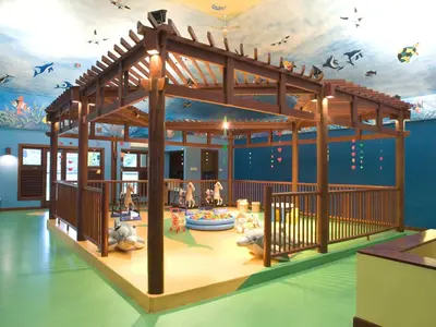 a childrens play area with a playground in a room at The Patra Bali Resort & Villas - CHSE Certified in Kuta