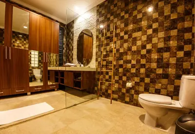 a bathroom with a toilet and a sink at Villa Suzuki 1 Seminyak in Seminyak