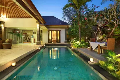 a swimming pool in the backyard of a villa at The Buah Bali Villas in Seminyak