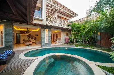 a swimming pool in the backyard of a house at Villa Suzuki 2 Seminyak in Seminyak