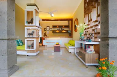 a living room with a couch and a table at Heliconia Villa in Seminyak