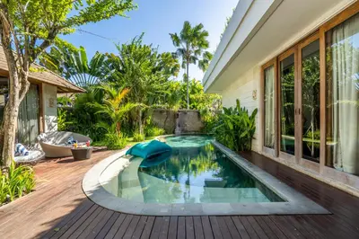 a swimming pool in the backyard of a house at The Akasha Seminyak Bali Luxury Villas in Seminyak