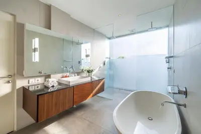 a bathroom with a sink and a mirror at Villa Jekumah in Seminyak