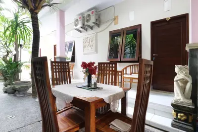 a dining room with a table and chairs at Anantaya Home Denpasar in Denpasar