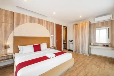 a bedroom with a large bed in a room at Cove Villa Prana in Jimbaran