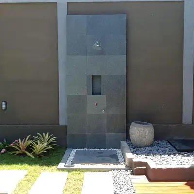 a glass shower in the side of a house at Gracia Bali Villas & Apartment Managed by Manara in Seminyak