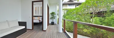a room with a balcony with a bed and a bedroom at Villa La Sirena by Nagisa Bali in Seminyak