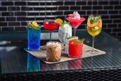 a group of drinks on a tray on a table at The Lokha Legian Resort & Spa in Legian