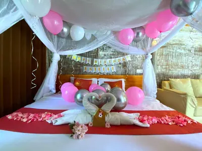 a bed with pink and purple balloons and a bed with a bed at PROMO! Private Vacation Rentals Villa, 2 Pools,4 Bedrooms,4 Bathrooms, Bali Seminyak in Seminyak