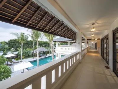 a view of the pool from the balcony of a house at Villa Eva in Seminyak