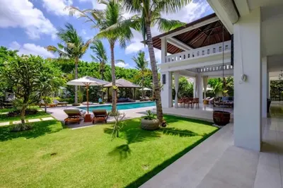 an exterior view of a villa with a swimming pool at Villa Eva in Seminyak