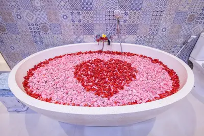 a large pink heart in a bath tub at Ambermoon Villa 2 in Seminyak