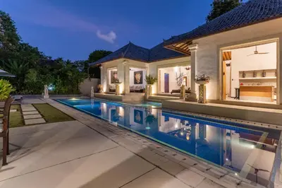 a swimming pool in the backyard of a house at Villa Dewata 3 in Seminyak