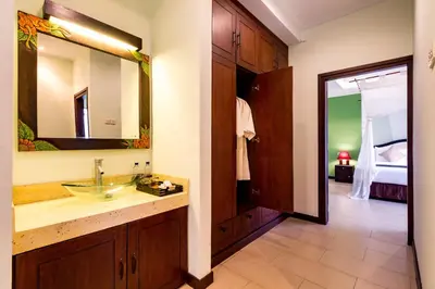 a bathroom with a sink and a mirror at Villa Chandraika - 3BR Private Pool Villa by AGATA in Seminyak