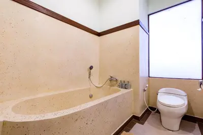 a bathroom with a tub and a toilet at Villa Chandraika - 3BR Private Pool Villa by AGATA in Seminyak