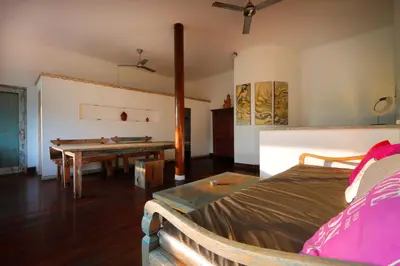 a bedroom with a bed and a ping pong table at Pearl Boutique Hotel Adult only in Legian
