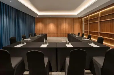 a conference room with a long table and chairs at Fairfield by Marriott Bali Kuta Ngurah Rai in Kuta