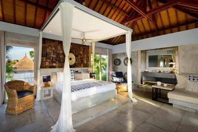 a bedroom with a large bed and a balcony at Lavish 5 Bed, Sleeps 10, Butler, Daily Breakfast in Canggu