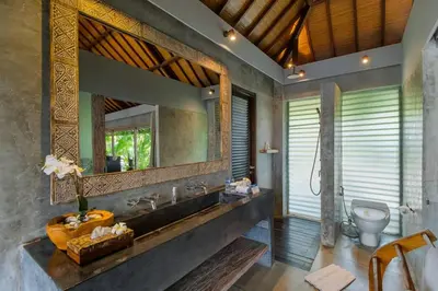 a bathroom with a sink and a toilet at Lavish 5 Bed, Sleeps 10, Butler, Daily Breakfast in Canggu