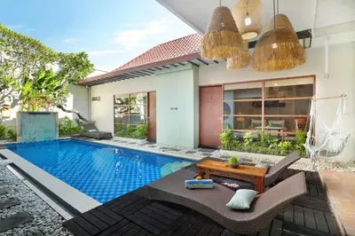 a swimming pool in the backyard of a villa at The Vie Villa Legian in Legian