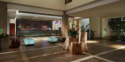 a lobby of a hotel with a waiting area at Sun Island Hotel & Spa Kuta in Kuta