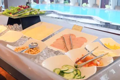 a buffet with different types of food on display at Sun Island Hotel & Spa Kuta in Kuta