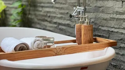 a bathroom with a sink and a bath tub at Del Cielo Villa Jimbaran in Jimbaran