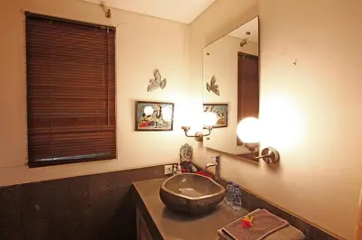 a bathroom with a sink and a mirror at Villa Santi Seminyak in Seminyak