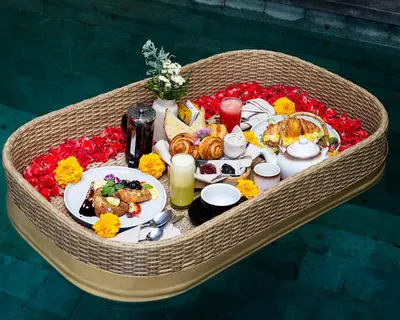 a table with food and drinks on top at Adepa Resort in Canggu