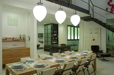 a large dining room with a table and chairs at Villa Alina in Seminyak