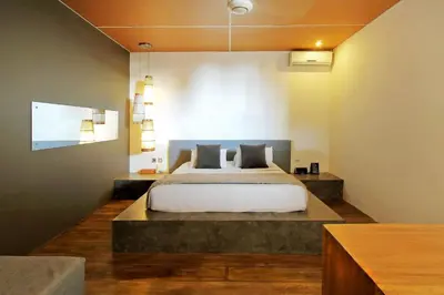 a bedroom with a large bed in a room at Clio Apartment in Seminyak
