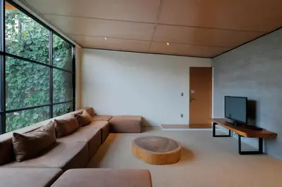 a living room with a couch and a coffee table at Clio Apartment in Seminyak