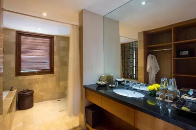 a bathroom with a sink and a bath tub at Maca Villas and Residence Umalas in Seminyak