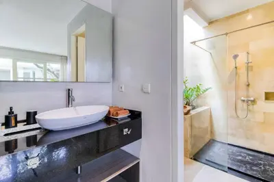 a bathroom with a sink and a shower at Private 2 Bed Pool Villa in Bustling Petitenget in Seminyak
