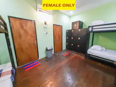 a room with two bunk beds and a sign that reads female only at The Legian 777 in Legian