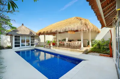 an image of a villa with a swimming pool at HARRIS Hotel & Residences Sunset Road in Kuta