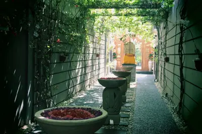 a row of vases lined up on a alley at The Nakula Villas in Legian