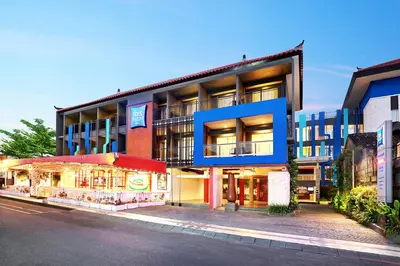 a building with a restaurant in front of it at Primera Hotel Seminyak in Seminyak